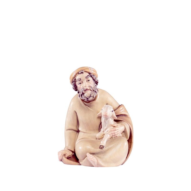 Shepherd sitting with lamb...