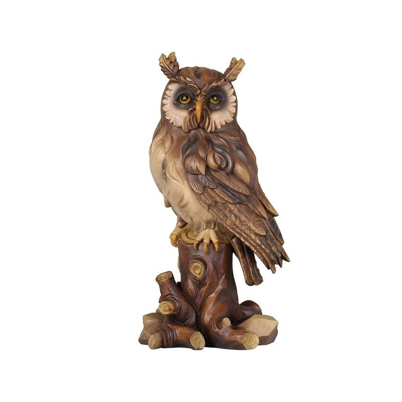 Owl on tree-trunk